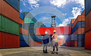 Engineer  and industrial workers Women  look Forklift truck handling container box