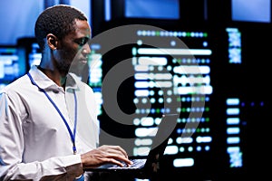 Engineer inspects blade servers