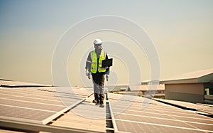 Engineer installing solar panels on the roof