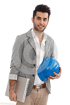 Engineer with laptop and hardhat
