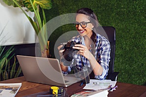 Engineer looking at photos that she took on camera that morning. - Image