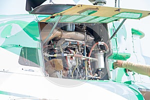 Engineer maintaining a helicopter Engine