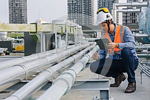 engineer male work checking water pipe inspecting valve testing water pump