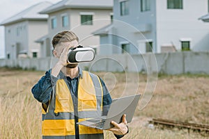 Engineer male worker using VR visual reality technology in construction industry