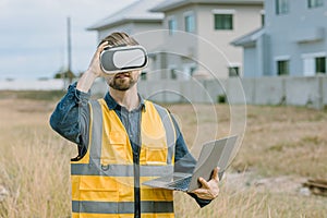 Engineer male worker using VR visual reality technology in construction industry