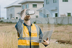 Engineer male worker using VR visual reality technology in construction industry