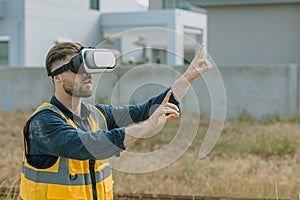 Engineer male worker using VR visual reality technology in construction industry