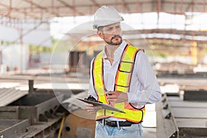 Engineer man checking inventory in the precast factory site, Foreman worker at construction site