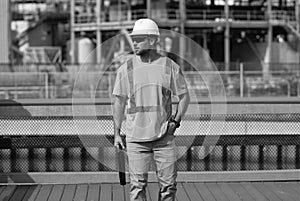 engineer man at construction site. engineer man at construction site wearing hardhat.