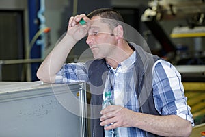 engineer man drink water in hot summer day