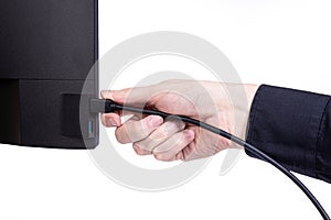 IT engineer Man hand inserts cable into monitor. Man hand connecting the DVI cable for monitor to computer PC. VGA DVI DisplayPort