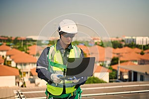 Engineer man installing solar panels on the roof