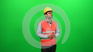 Engineer Man Looking Around Examining Construction Activity on Green Screen Background