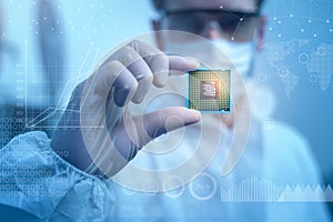 Engineer man  in sterile suit is holding Microchip with symbols in modern design factory  , futuristic and artificial intelligence