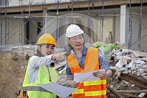 Engineer manager inspects construction sites and checking blueprints at building townhome project