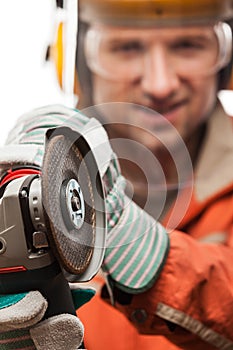 Engineer or manual worker man in safety hardhat helmet holding a