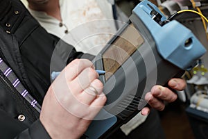 Engineer measuring fiber optic