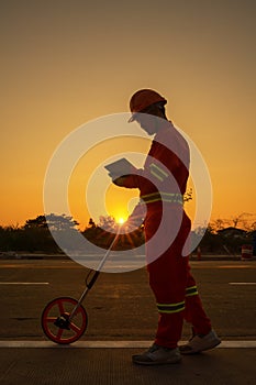 Engineer measuring road distances photo