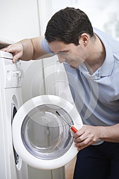 Engineer Mending Domestic Washing Machine