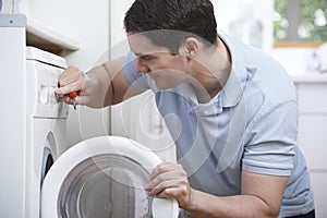 Engineer Mending Domestic Washing Machine