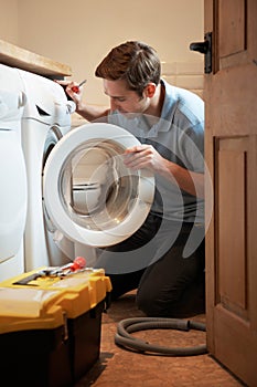 Engineer Mending Domestic Washing Machine