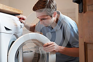 Engineer Mending Domestic Washing Machine