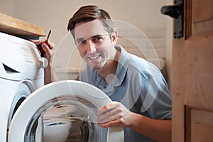 Engineer Mending Domestic Washing Machine