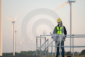 Engineer at natural energy wind turbine site with a mission to climb up to the wind turbine blades