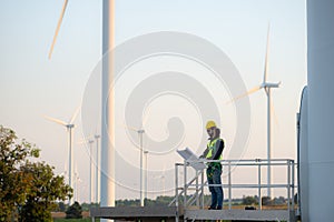 Engineer at natural energy wind turbine site with a mission to climb up to the wind turbine blades