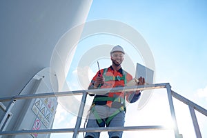 Engineer at natural energy wind turbine site Must use a computer to control check