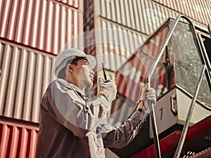 Engineer is pointing controlling the job at the Container cargo