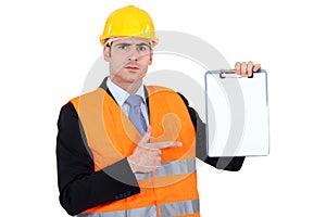 Engineer pointing to a clipboard