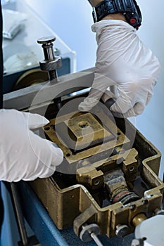 Engineer preparing a direct shear laboratory test for civil construction purpose
