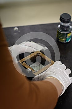 Engineer preparing a soil sample in a mold for direct shear laboratory test