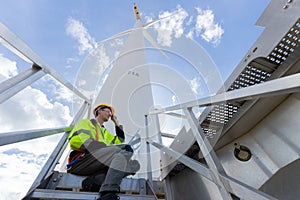 Engineer professional techician male working using laptop setup wind turbines system control operate service at location site