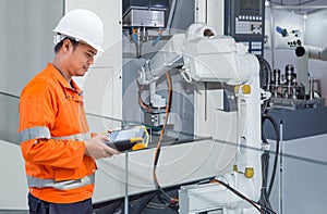 Engineer programming automatic robotic hand machine tool CNC