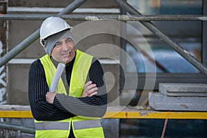 Engineer with protective workwear freezing outdoors photo