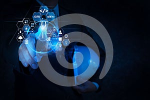 engineer pushing start button on touch screen computer