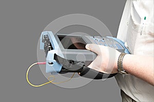 Engineer with reflectometer