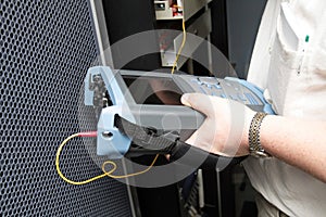 Engineer with reflectometer