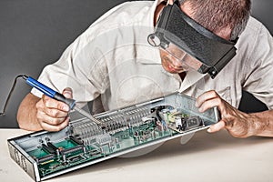 Engineer repairing circuit board