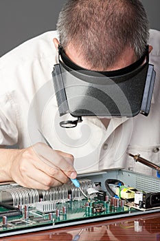 Engineer repairing circuit board