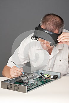 Engineer repairing circuit board