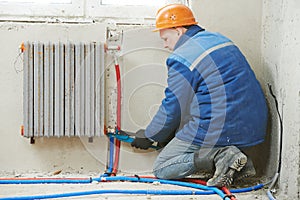 Engineer repairmen installing heating system