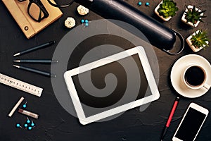 Engineer`s desk in office with various gadgets and documents