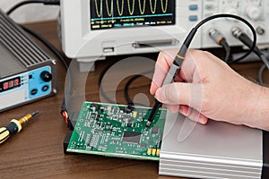 Engineer's hands holding probes