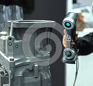 Engineer scans the part with 3D scanner. Technology scanning