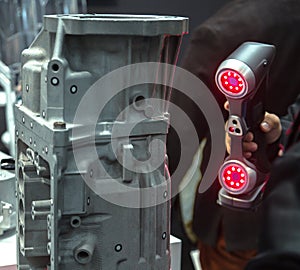 Engineer scans the part with 3D scanner. Technology scanning