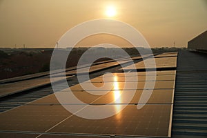 Engineer service check installation solar cell on the roof of factory.