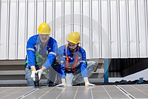 Engineer set installing and inspect standards of solar panels on roof of an industrial factory. Team technician inspection and